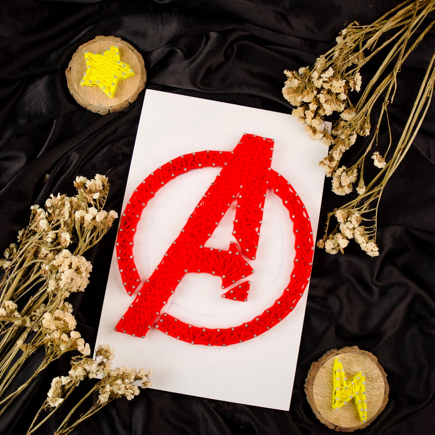 Red Avengers logo string art – handmade wall decor for Marvel superhero fans and collectors.