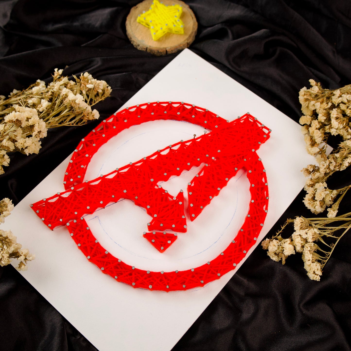 Handcrafted Avengers symbol string art – unique superhero room decor for comic book enthusiasts.