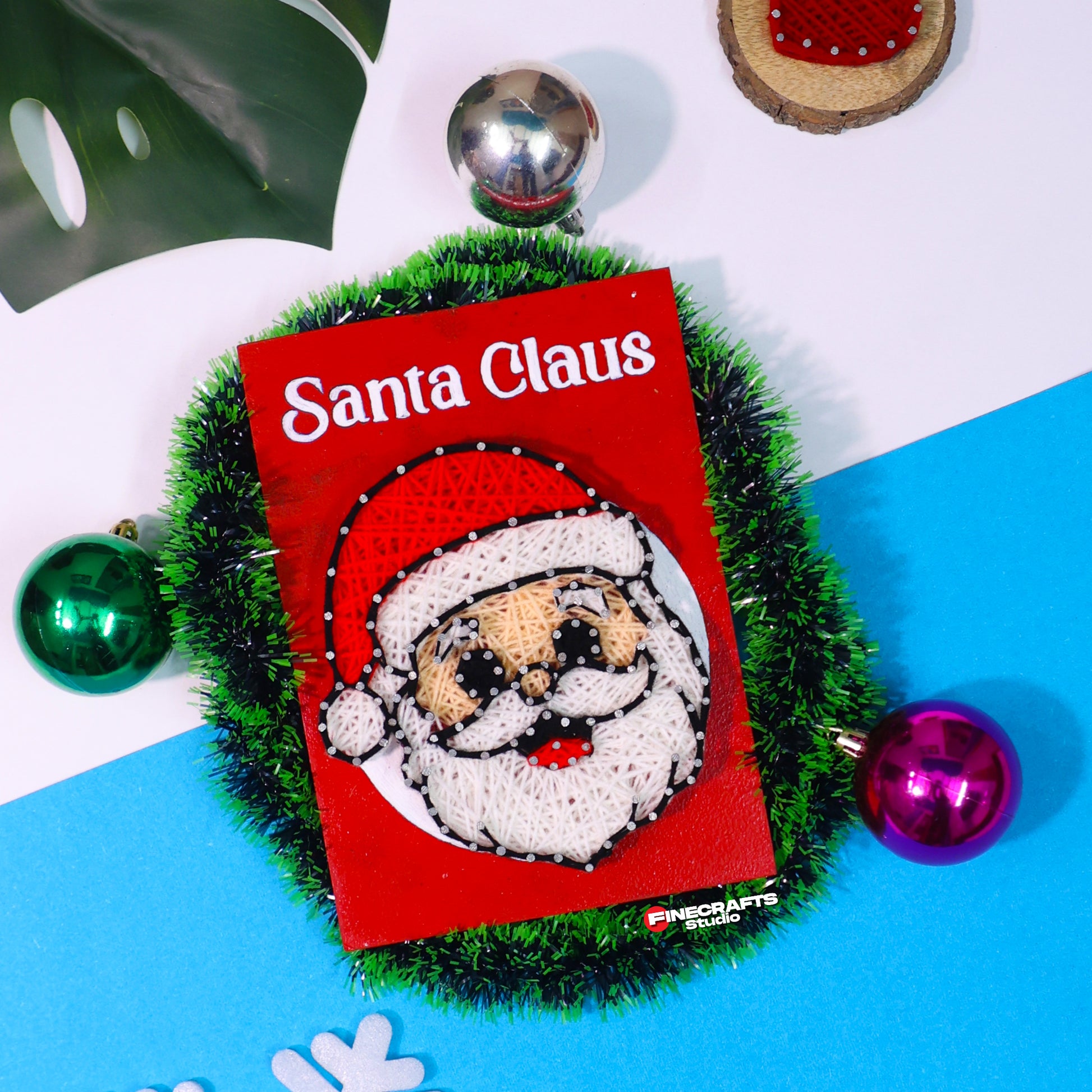 Handmade Santa Claus string art on red wooden board – festive Christmas wall decor for holiday gifting.