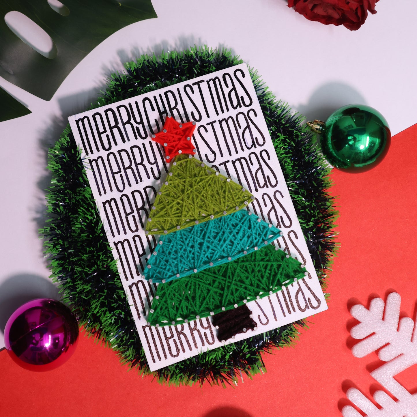 DIY Christmas tree string art on white wooden board with “Merry Christmas” text – perfect for holiday wall hanging or gifting.