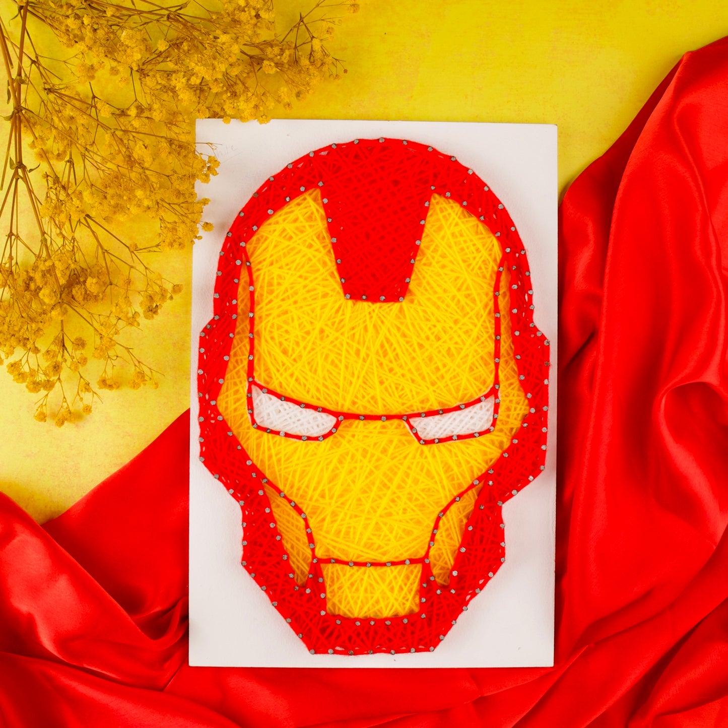 Iron Man helmet string art – handcrafted Marvel wall decor for superhero fans.