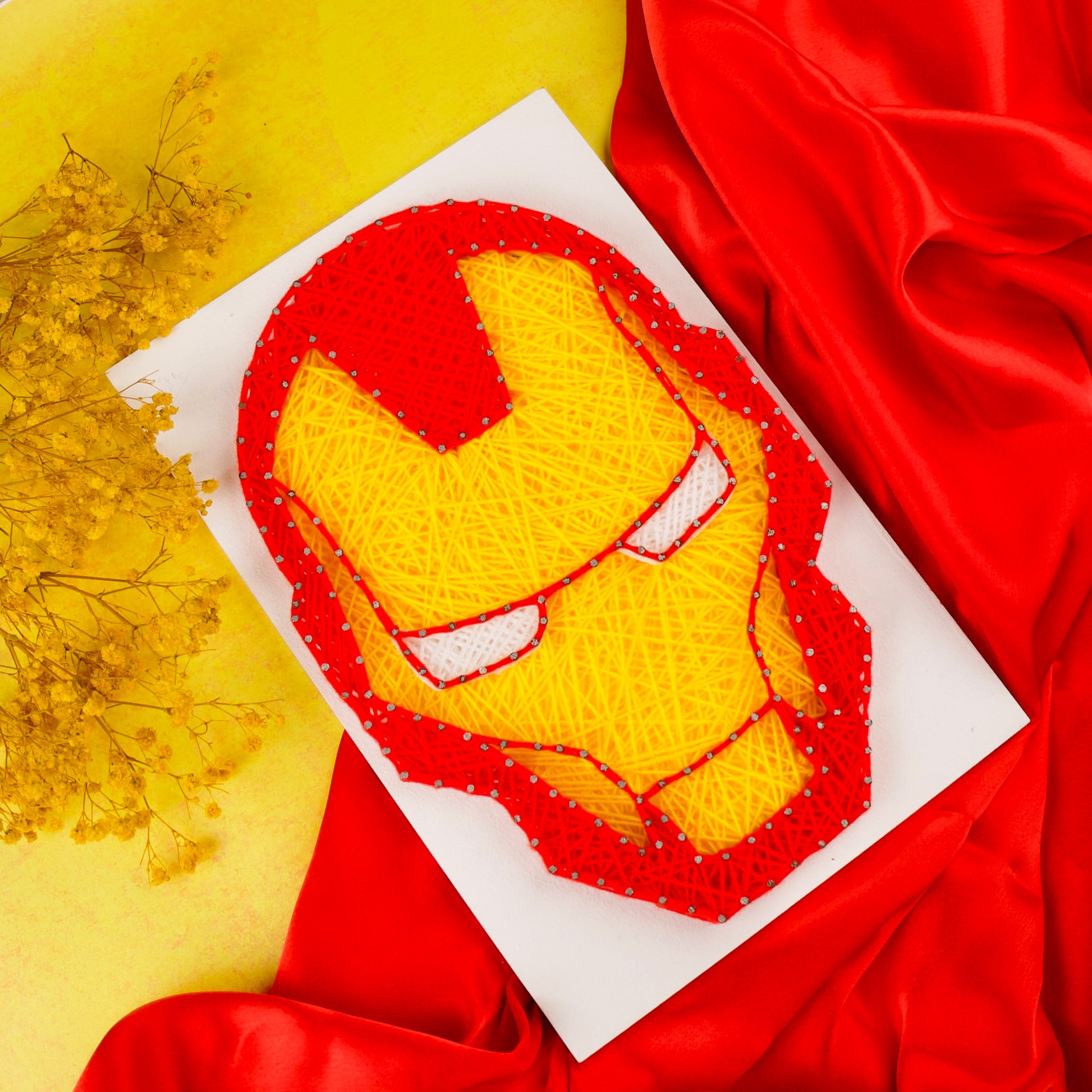 Vibrant red and yellow Iron Man string art – perfect gift for Marvel lovers and collectors.