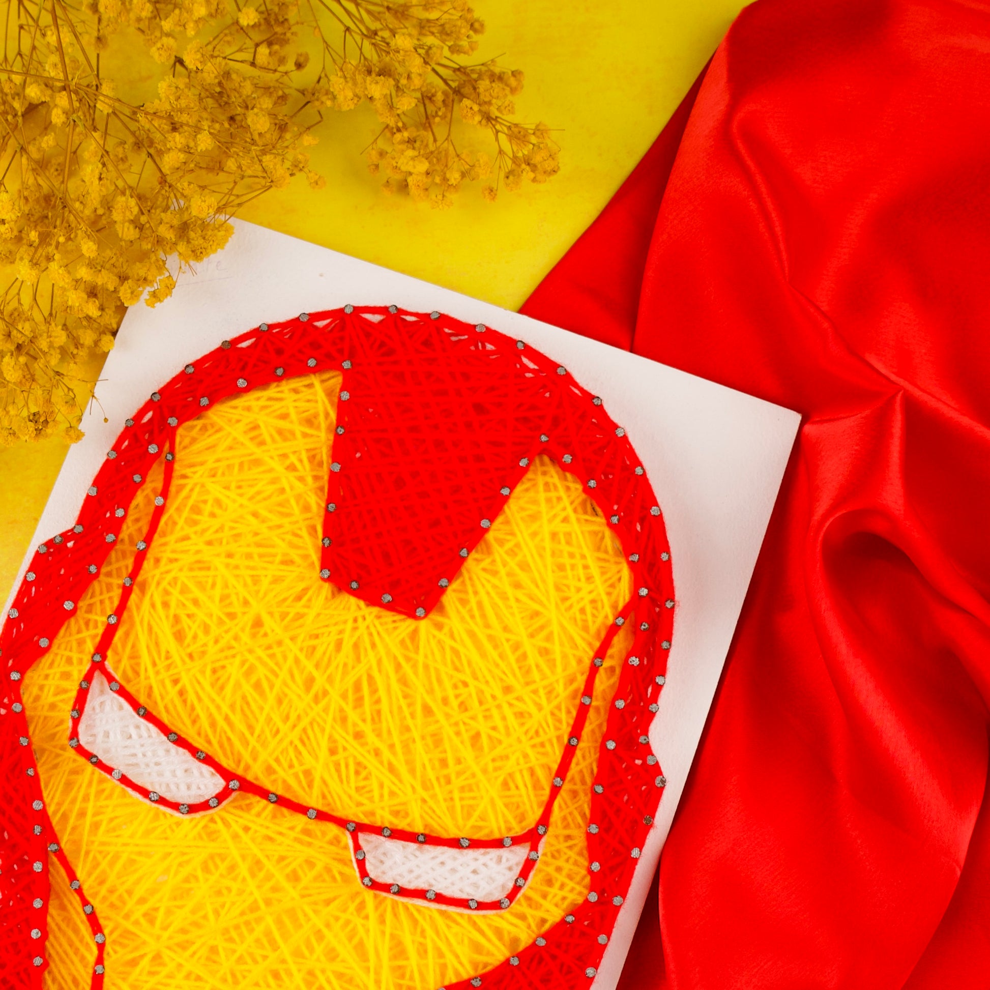 Custom Iron Man face design in string art – geeky wall art for kids and adults.