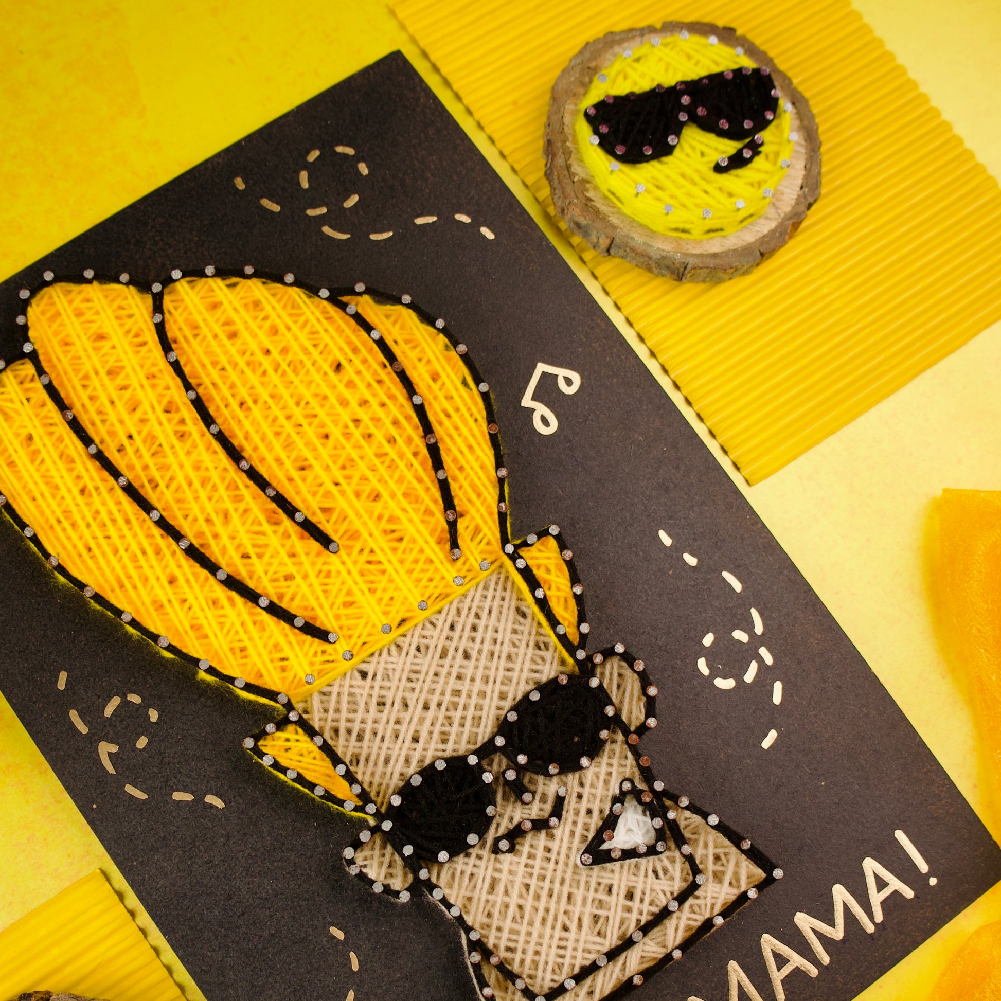 Handcrafted Johnny Bravo string art featuring yellow yarn hair, perfect for cartoon-themed room decor.
