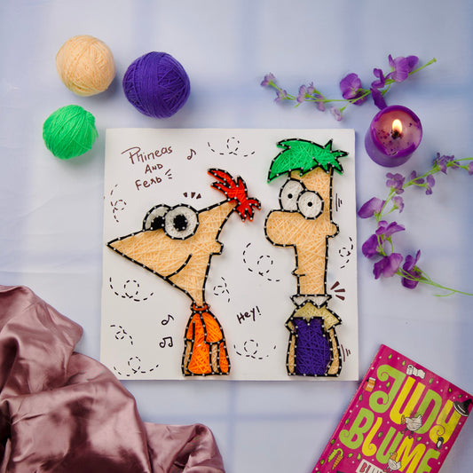 Colorful Phineas and Ferb string art on white board, handmade yarn wall decor for cartoon fans.