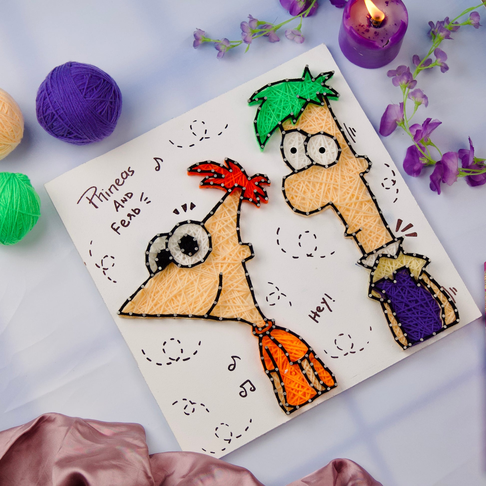 Handcrafted Phineas and Ferb string art, vibrant threadwork perfect for kids’ room wall art.